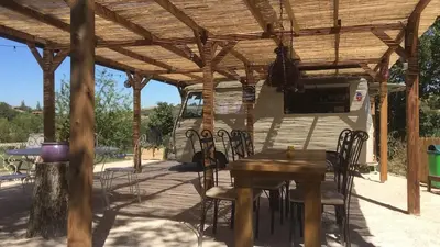 a kitchen with a sink and a microwave at Domaine du Cammazet in Lapenne