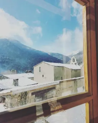 a view of a building from a window at la maison sous le château in Montségur