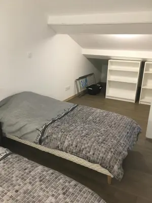 a bedroom with a bed in a room at La Cathare Appartement 2 chambres in Lézignan-Corbières