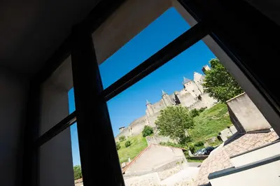 an open window with a view of a castle at Le Loft de La Tour Pinte in Carcassonne