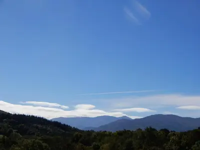 a view of the mountains and clouds in the sky at Infocus-Du-Sud in Soula