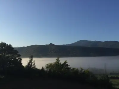 a view of a lake with mountains in the background at Infocus-Du-Sud in Soula
