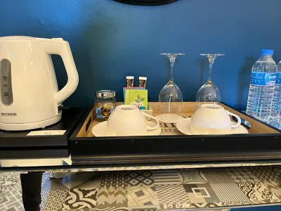 a tray with two cups and a coffee maker and glasses at Chez Montiz in Montazels