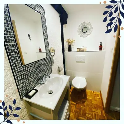 a bathroom with a sink and a toilet at La Terrasse in Sorèze