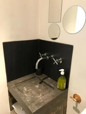 a bathroom sink with a faucet and a mirror at La maison d' Elizabeth in Lagrasse