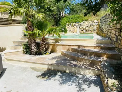 a set of stairs leading to a swimming pool at Camin del Bosc in Roquefort-des-Corbières