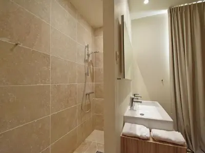 a bathroom with a sink and a shower at Tranquil Stay in Villesèque in Villesèque-des-Corbières