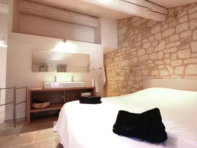 a bedroom with a white bed and a sink at Serene Family Escape in Villesèque-des-Corbières