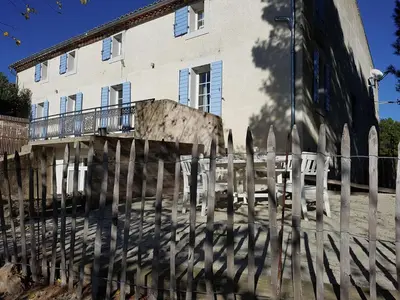 a fence in front of a building at Serene Family Escape in Villesèque-des-Corbières