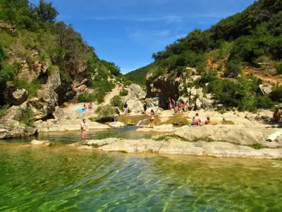 a group of people swimming in a river at Gîte San Jordi in Duilhac