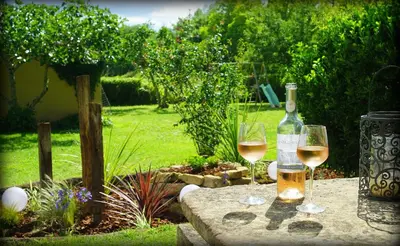 two glasses of white wine sitting on a table at Domaine de Pouroutounat in Mirepoix