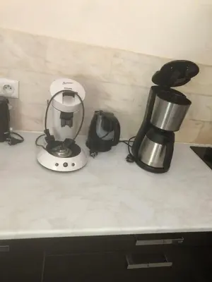 a kitchen counter with a blender and a coffee maker at le verso in Narbonne