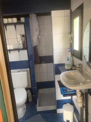 a small bathroom with a toilet and a sink at Location Nuit Studio Port Gruissan in Gruissan