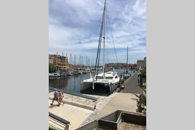 a group of boats are docked in a marina at Location Nuit Studio Port Gruissan in Gruissan