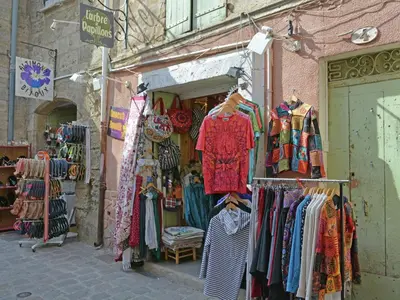 a store with a bunch of clothes on display at Classy Apartment in Villesèque-des-Corbières with Swimming Pool in Villesèque-des-Corbières