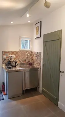 a kitchen with a sink and a counter top at Beautiful studio surrounded by nature in Lanet