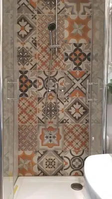 a bathroom with a shower with a tile wall at Beautiful studio surrounded by nature in Lanet