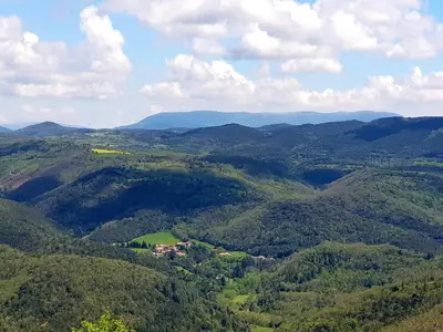 an aerial view of a mountain valley with a house at Beautiful studio surrounded by nature in Lanet