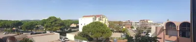 an aerial view of a city with buildings and trees at Studio plage du Grazel in Gruissan