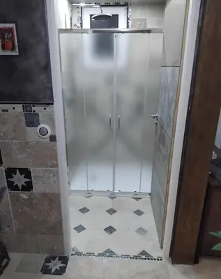 a shower with a glass door in a bathroom at Drissia&Othman Atipik in Carcassonne