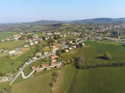 an aerial view of a small village in a field at LES CHALETS D HERMINE in Montredon-Labessonnié