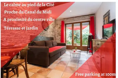 a living room with a couch and a table at L'atypique, La Vue et le Standing du 36 ! Emplacement, clim et extérieur ! in Carcassonne