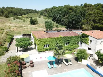 an aerial view of a house with a swimming pool at Gîte le Relais de la Cavayere in Carcassonne