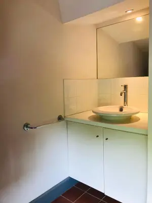 a bathroom with a sink and a mirror at DOLCE VITA in Carcassonne