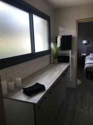 a room with a counter with two windows at Fun and sun room in Salles-d'Aude