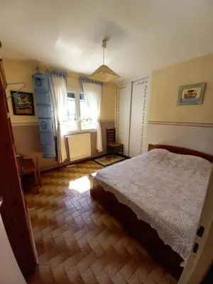 a bedroom with a bed and a window at Los olivos in Bize-Minervois