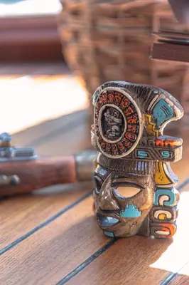 a small owl jar sitting on top of a table at Bateau Le Nubian in Narbonne