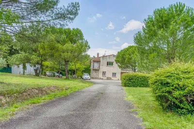 an empty road in front of a house at Les Vignes de Carcassonne - Classé 4 étoiles Piscine et clim in Capendu