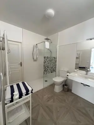 a white bathroom with a toilet and a sink at Manoir et Appartements avec piscine au Domaine de Bize Mirepoix in Mirepoix