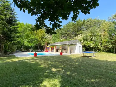a yard with a pool and a pavilion at Manoir et Appartements avec piscine au Domaine de Bize Mirepoix in Mirepoix
