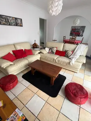 a living room with two couches and a coffee table at Maison vivancos in Narbonne