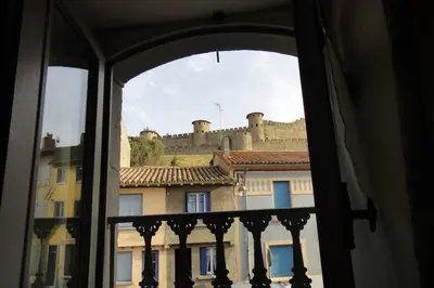 a view of a castle from a window at La casa Trivala in Carcassonne