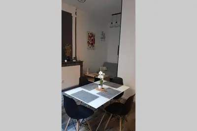 a dining room with a table and chairs at restez zen in Carcassonne