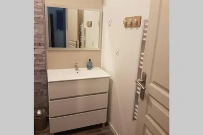 a bathroom with a sink and a mirror at restez zen in Carcassonne