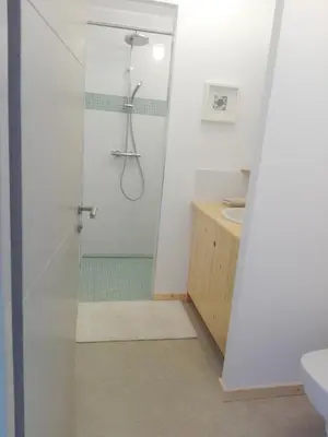 a bathroom with a shower and a sink at l-Ostalet in Bages