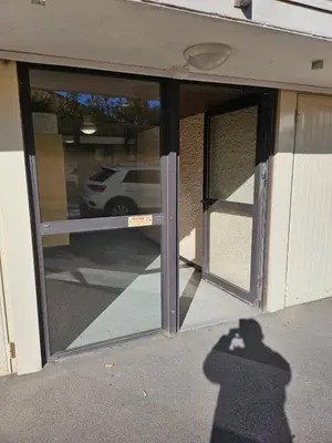 a shadow of a person taking a picture of a car in a window at PALMA II in Port-la-Nouvelle