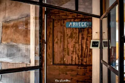 a street sign in front of a door at Logis Hotel Nature Cathare in Léran