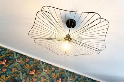 a ceiling light with a butterfly design on a ceiling at Maison La Majorelle - 90m2 - Garage et Terrasse in Pamiers