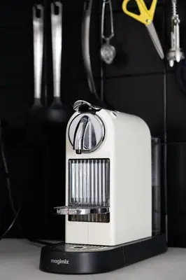 a toaster sitting on top of a table with scissors at Maison La Majorelle - 90m2 - Garage et Terrasse in Pamiers