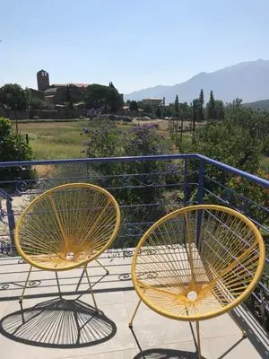 two chairs sitting on top of a balcony at Els Pirineus in Molitg les Bains
