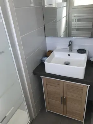 a bathroom with a sink and a mirror at Els Pirineus in Molitg les Bains