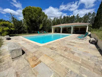 a pool with chairs and a gazebo at Maison Saraphina in Cruzy