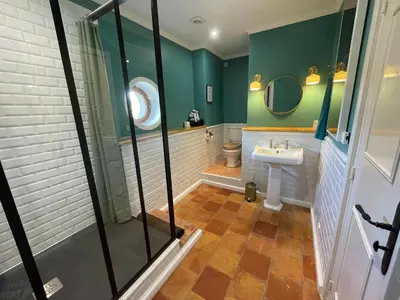 a bathroom with a toilet and a sink at Maison Saraphina in Cruzy