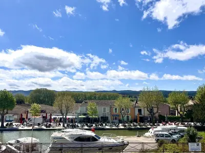 a group of boats parked in a marina at Villa 110m2, 7 pers, Jacuzzi , 3 chambres, terrain clos et arboré 2500m2 in Trèbes