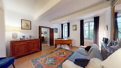 a living room with a couch and a table at Les Terrisses - Chambres d'hôtes avec piscine in Saint-Félix-Lauragais