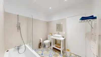 a white bathroom with a sink and a shower at Les Terrisses - Chambres d'hôtes avec piscine in Saint-Félix-Lauragais